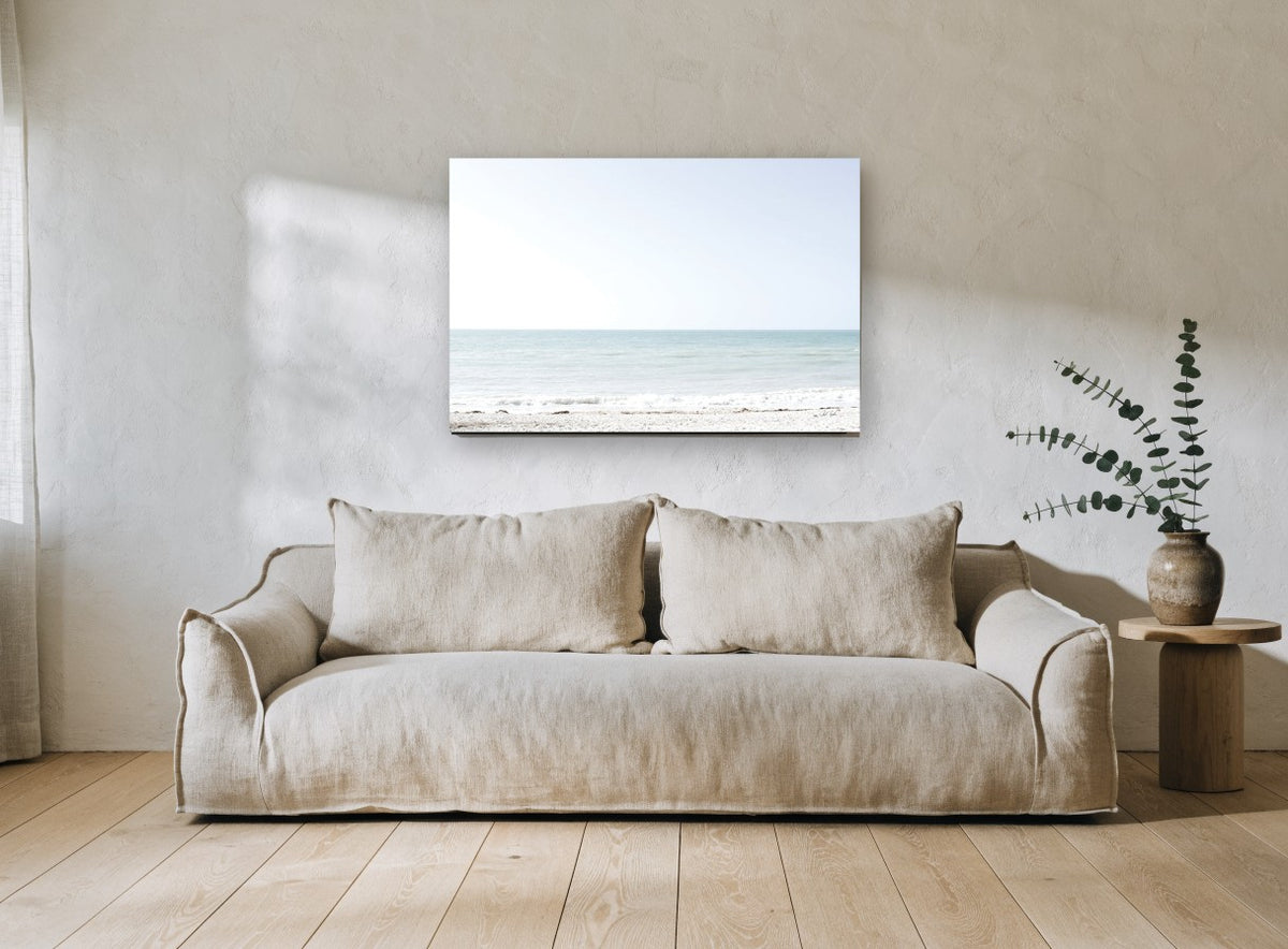 Pale Aqua Horizon coastal canvas print on the wall of a living room