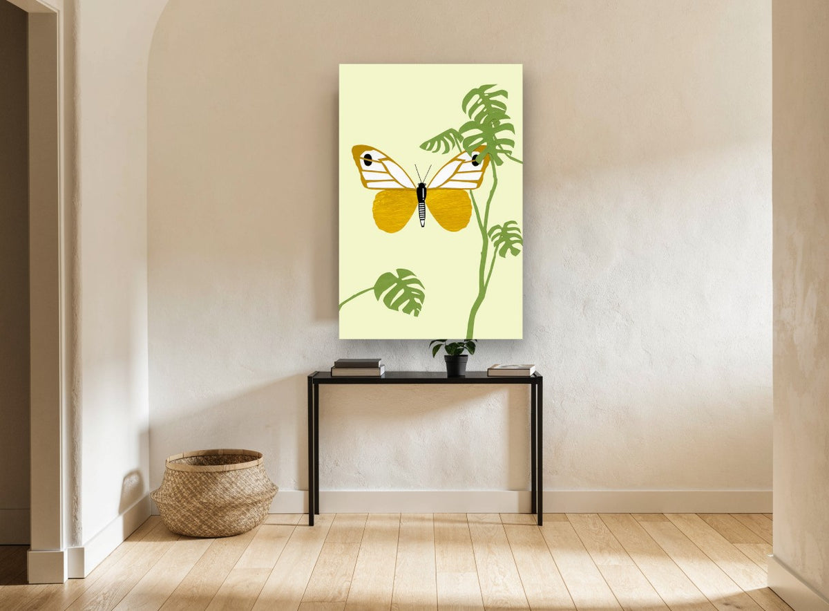 Gold Butterfly Monstera floral canvas print on the wall of a hallway