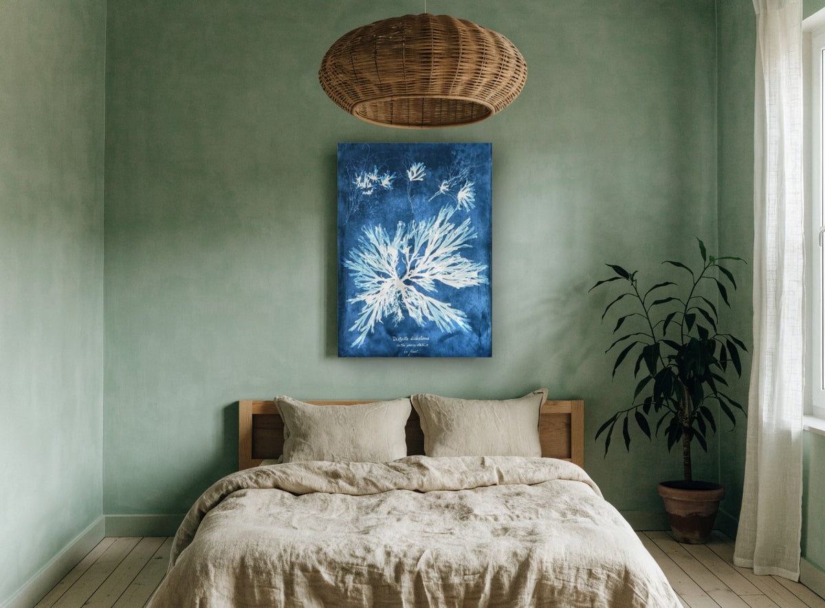 Indigo Seaweed Frond Burst vintage canvas print on the wall of a bedroom