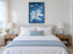 Indigo Seaweed Frond Burst vintage canvas print on the wall of a coastal bedroom