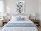 Teal Blooms in Negative floral canvas print on the wall of a coastal bedroom