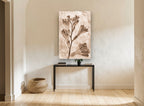 Sepia Freesia Stem floral canvas print on the wall of a hallway