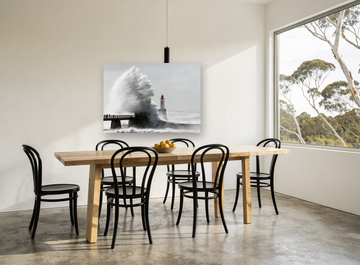 Storm Surge Lighthouse coastal canvas print on the wall of a dining room