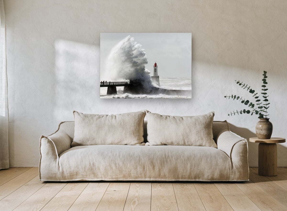Storm Surge Lighthouse coastal canvas print on the wall of a living room