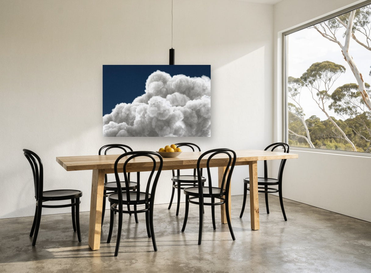 Billowing Cumulus Navy landscape canvas print on the wall of a dining room