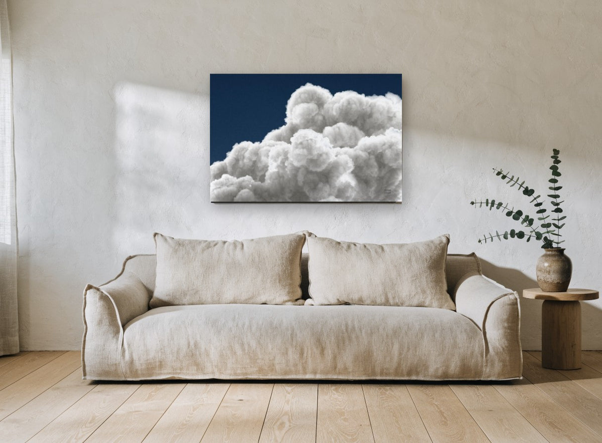 Billowing Cumulus Navy landscape canvas print on the wall of a living room
