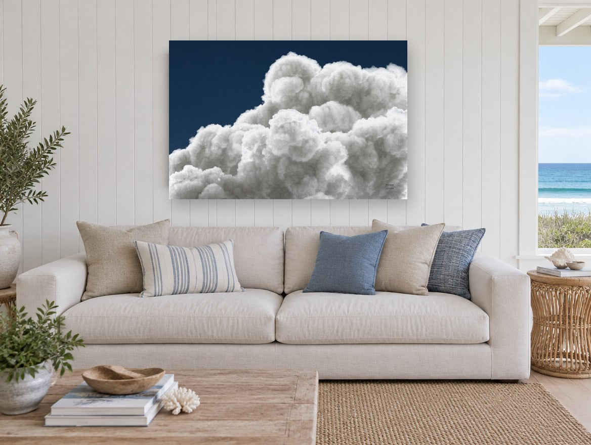 Billowing Cumulus Navy landscape canvas print on the wall of a beach house living room