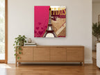 Paris in Magenta and Gold city canvas print on the wall of a living room above a sideboard