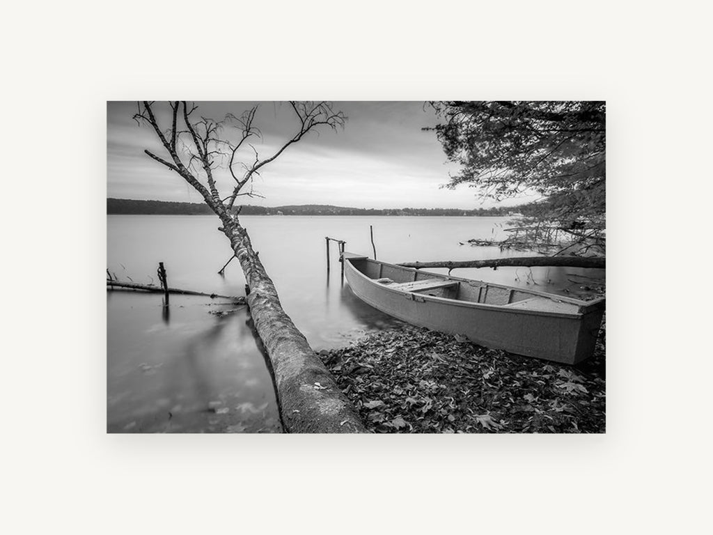 Still Shore Rowboat, black and white lake boat photograph, landscape canvas wall art print, front view