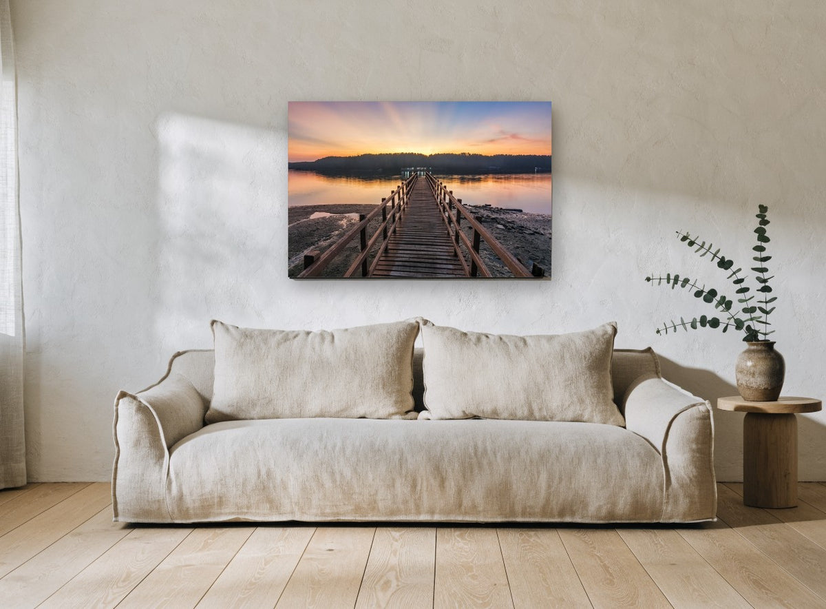 Jetty at First Light coastal canvas print on the wall of a living room