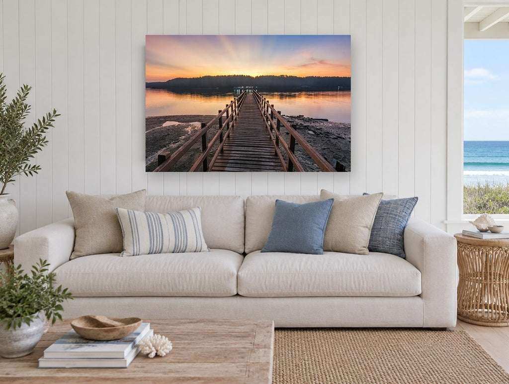 Jetty at First Light coastal canvas print on the wall of a beach house living room