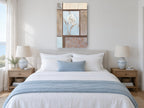 White Bloom in Blue Panel floral canvas print on the wall of a coastal bedroom