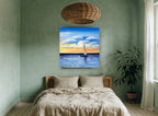 Sailing Into Amber Dusk coastal canvas print on the wall of a bedroom