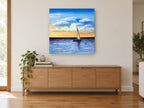 Sailing Into Amber Dusk coastal canvas print on the wall of a living room above a sideboard