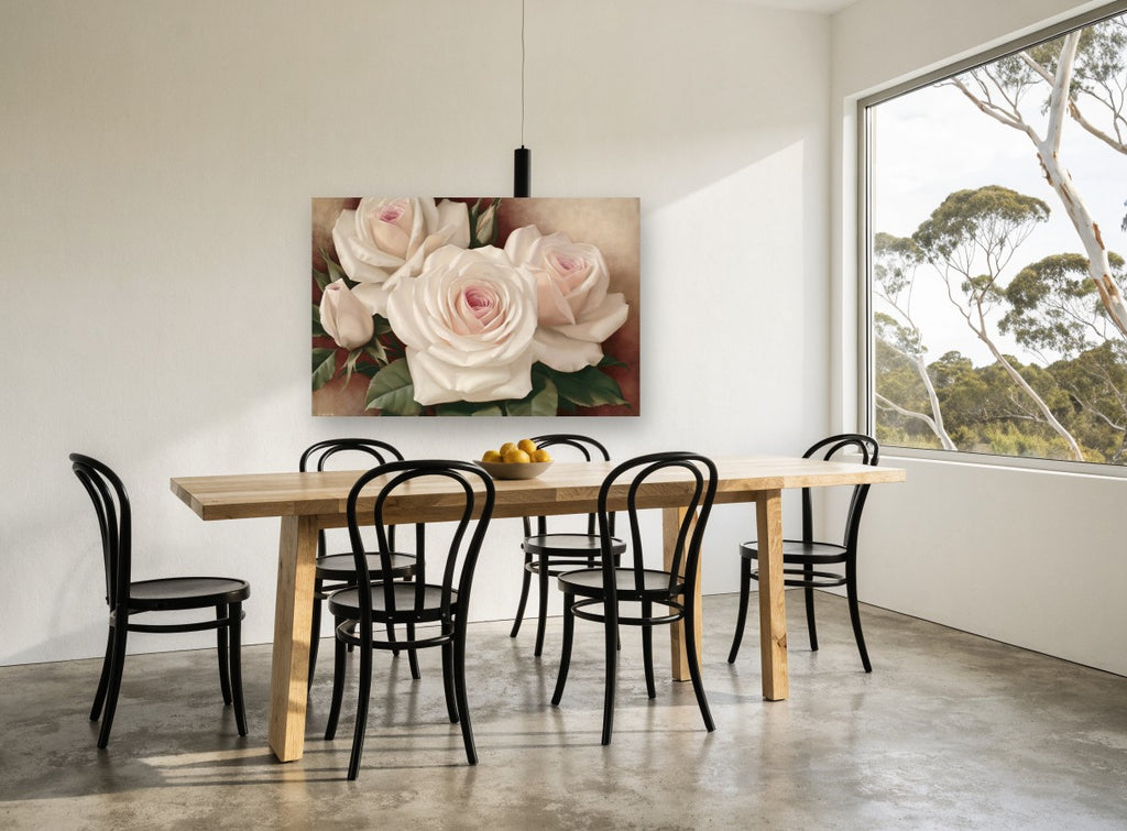 Blush Cream Rose Trio floral canvas print on the wall of a dining room
