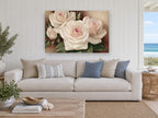 Blush Cream Rose Trio floral canvas print on the wall of a beach house living room