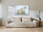 Arctic Family Huddle animal canvas print on the wall of a living room