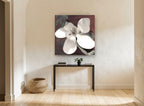 Open Magnolia on Rust floral canvas print on the wall of a hallway