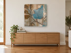 Blue Leaf on Sepia floral canvas print on the wall of a living room above a sideboard