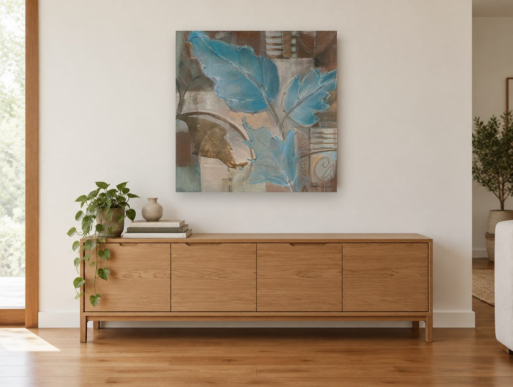 Blue Leaves on Linen floral canvas print on the wall of a living room above a sideboard