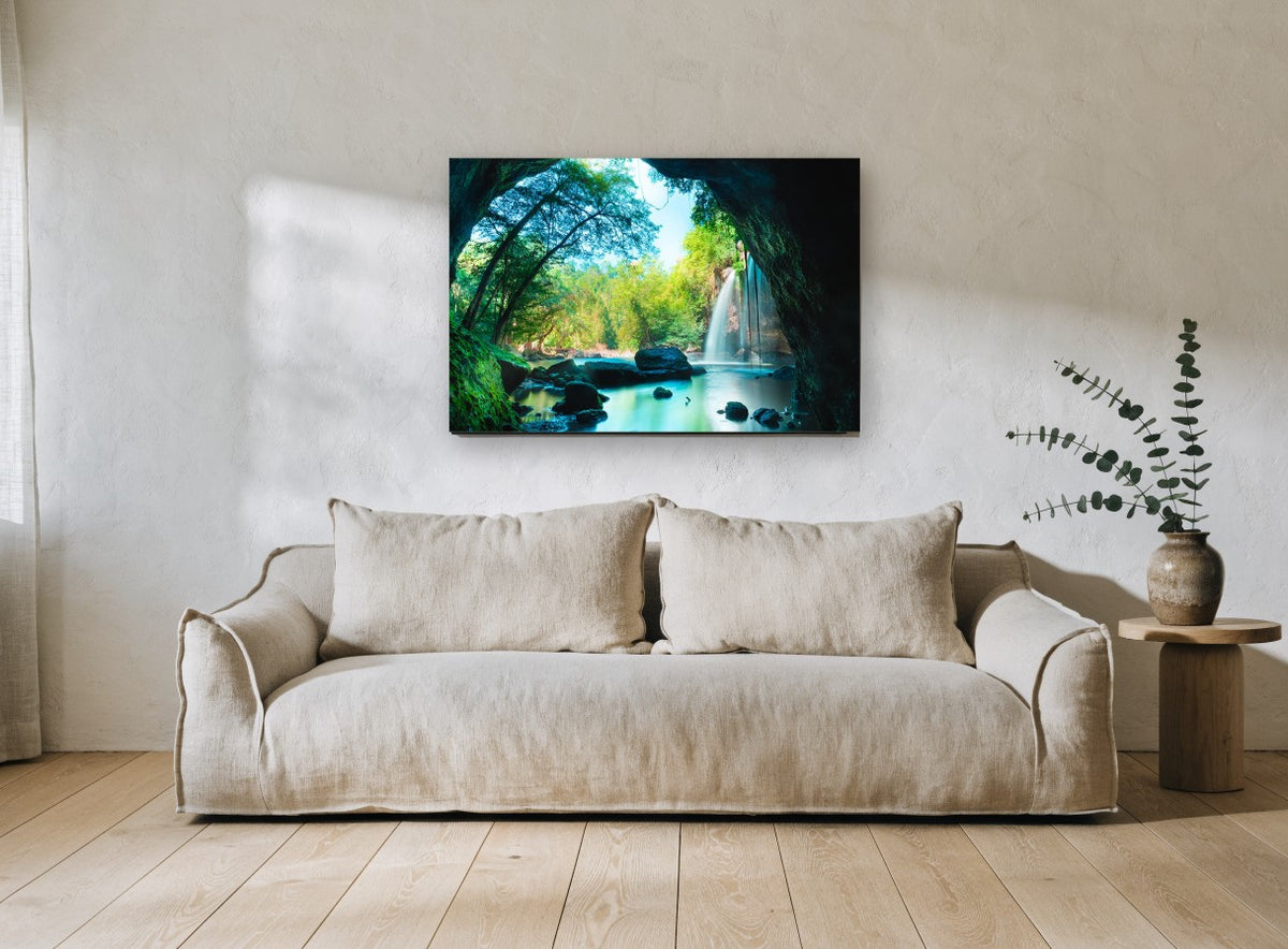 Cave Pool Falls landscape canvas print on the wall of a living room