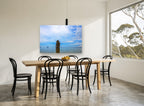 Lone Sea Stack coastal canvas print on the wall of a dining room