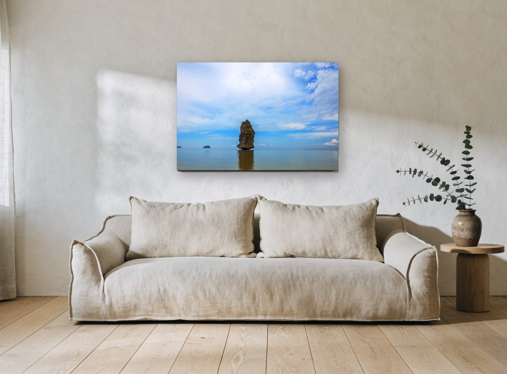 Lone Sea Stack coastal canvas print on the wall of a living room