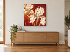 Cream Iris on Crimson floral canvas print on the wall of a living room above a sideboard