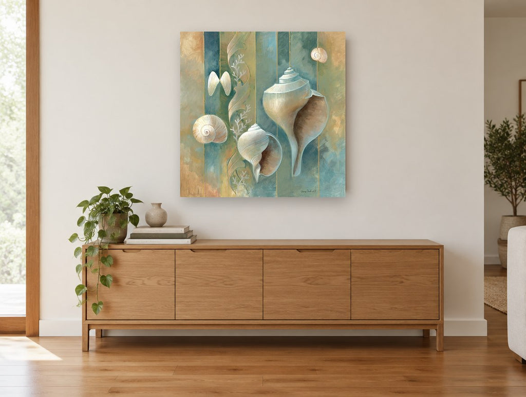 Striped Shell Collection coastal canvas print on the wall of a living room above a sideboard