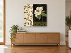 White Magnolia on Black floral canvas print on the wall of a living room above a sideboard