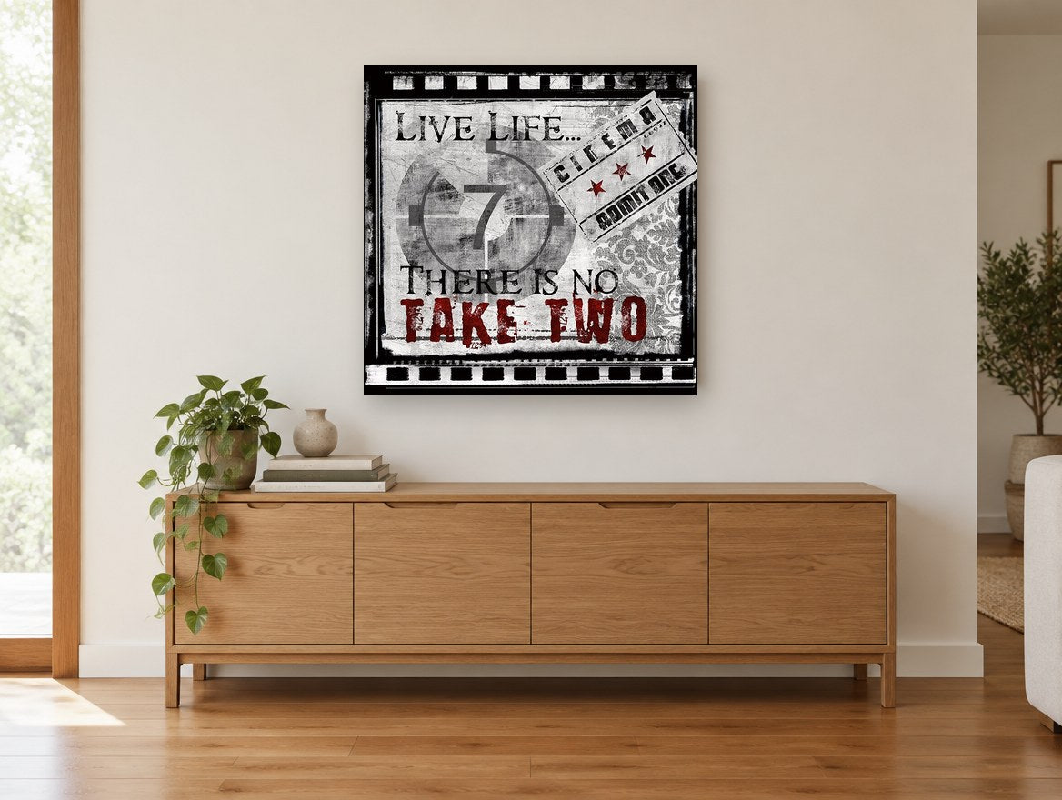 Live Life Take Two vintage canvas print on the wall of a living room above a sideboard