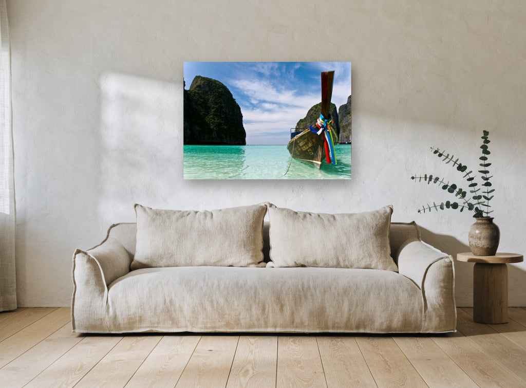 Longtail Boat Lagoon coastal canvas print on the wall of a living room