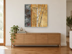 Birch Leaves Panel landscape canvas print on the wall of a living room above a sideboard