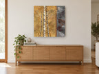 Birch Leaves Amber landscape canvas print on the wall of a living room above a sideboard