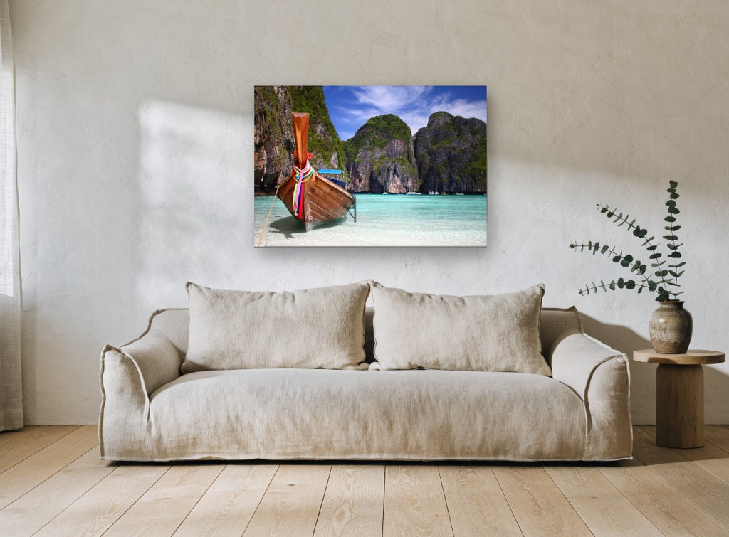 Longtail Boat Lagoon coastal canvas print on the wall of a living room