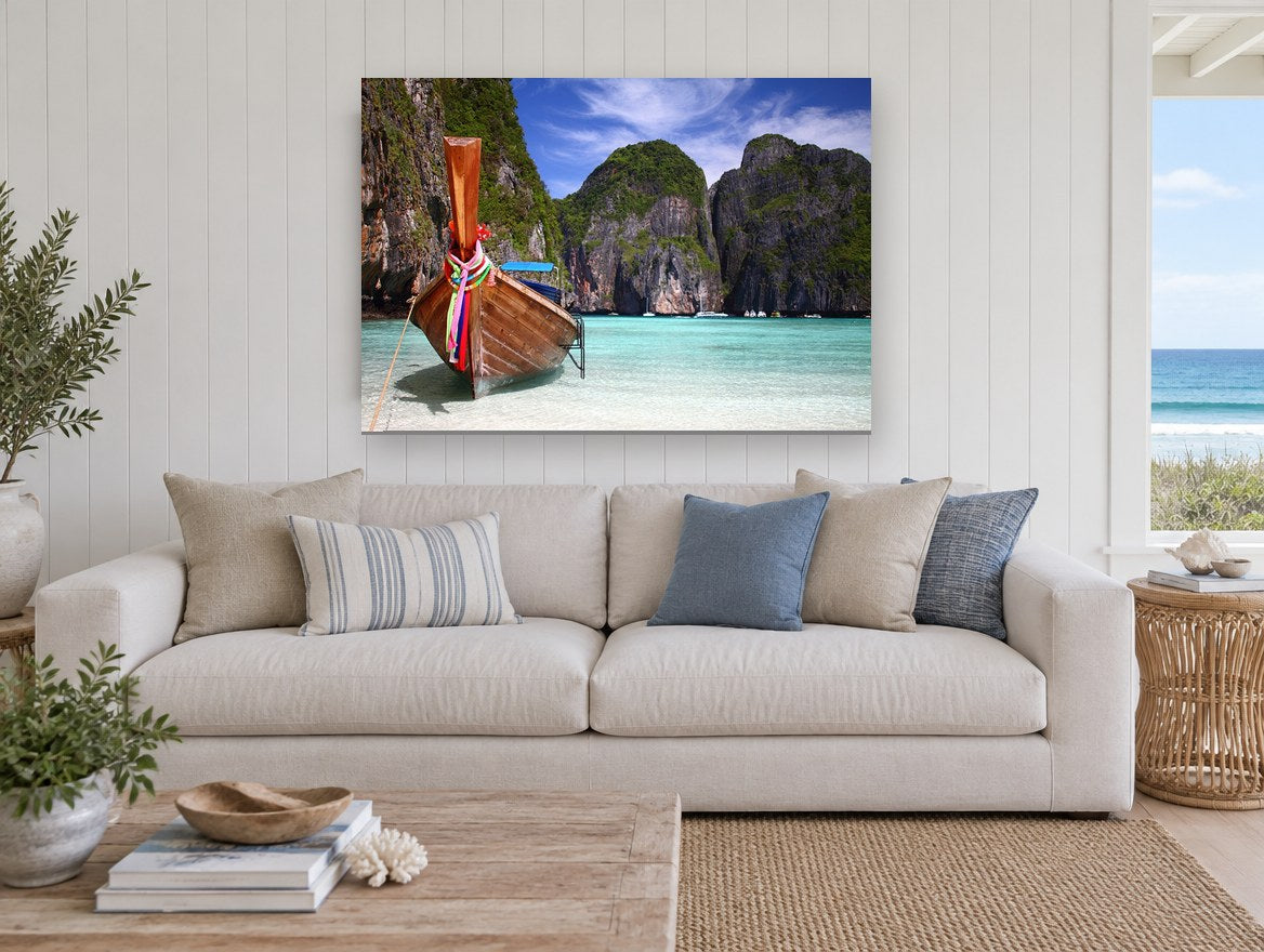 Longtail Boat Lagoon coastal canvas print on the wall of a beach house living room