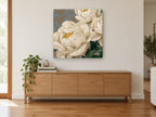 Cream Peonies on Damask floral canvas print on the wall of a living room above a sideboard