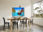 Longtail Boat Lagoon coastal canvas print on the wall of a dining room