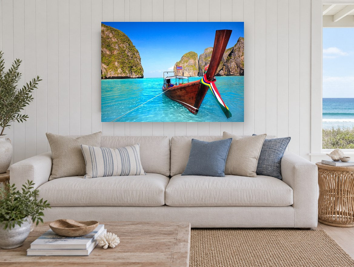 Longtail Boat Lagoon coastal canvas print on the wall of a beach house living room