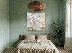 White Magnolia Stems in Glass floral canvas print on the wall of a bedroom