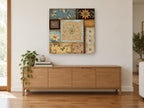 Teal and Gold Tile Patchwork floral canvas print on the wall of a living room above a sideboard