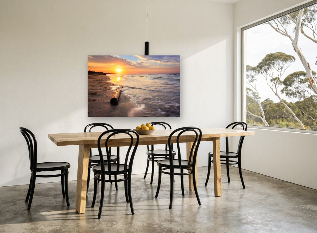 Driftwood at Dawn coastal canvas print on the wall of a dining room