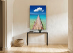 Turquoise Jetty Horizon coastal canvas print on the wall of a hallway
