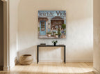 Blue Flower Shopfront floral canvas print on the wall of a hallway