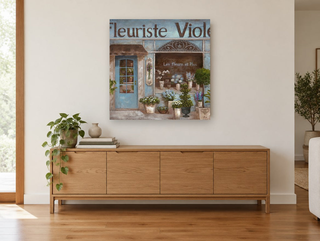Blue Flower Shopfront floral canvas print on the wall of a living room above a sideboard