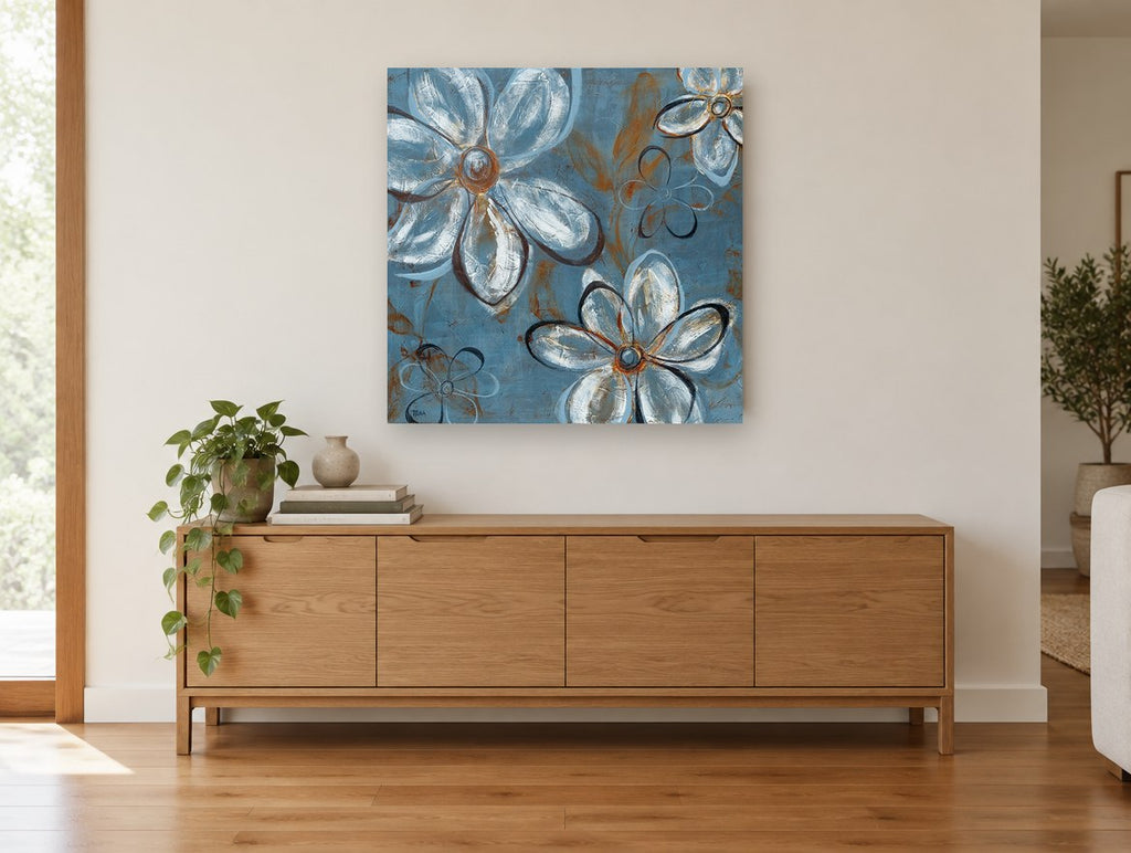Blue Daisy Drift floral canvas print on the wall of a living room above a sideboard