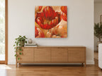 Open Red Tulip Glow floral canvas print on the wall of a living room above a sideboard