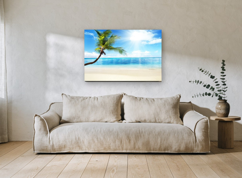 Leaning Palm Sunburst coastal canvas print on the wall of a living room