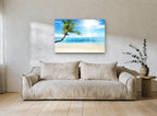 Leaning Palm Sunburst coastal canvas print on the wall of a living room