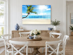 Leaning Palm Sunburst coastal canvas print on the wall of a Hamptons dining room